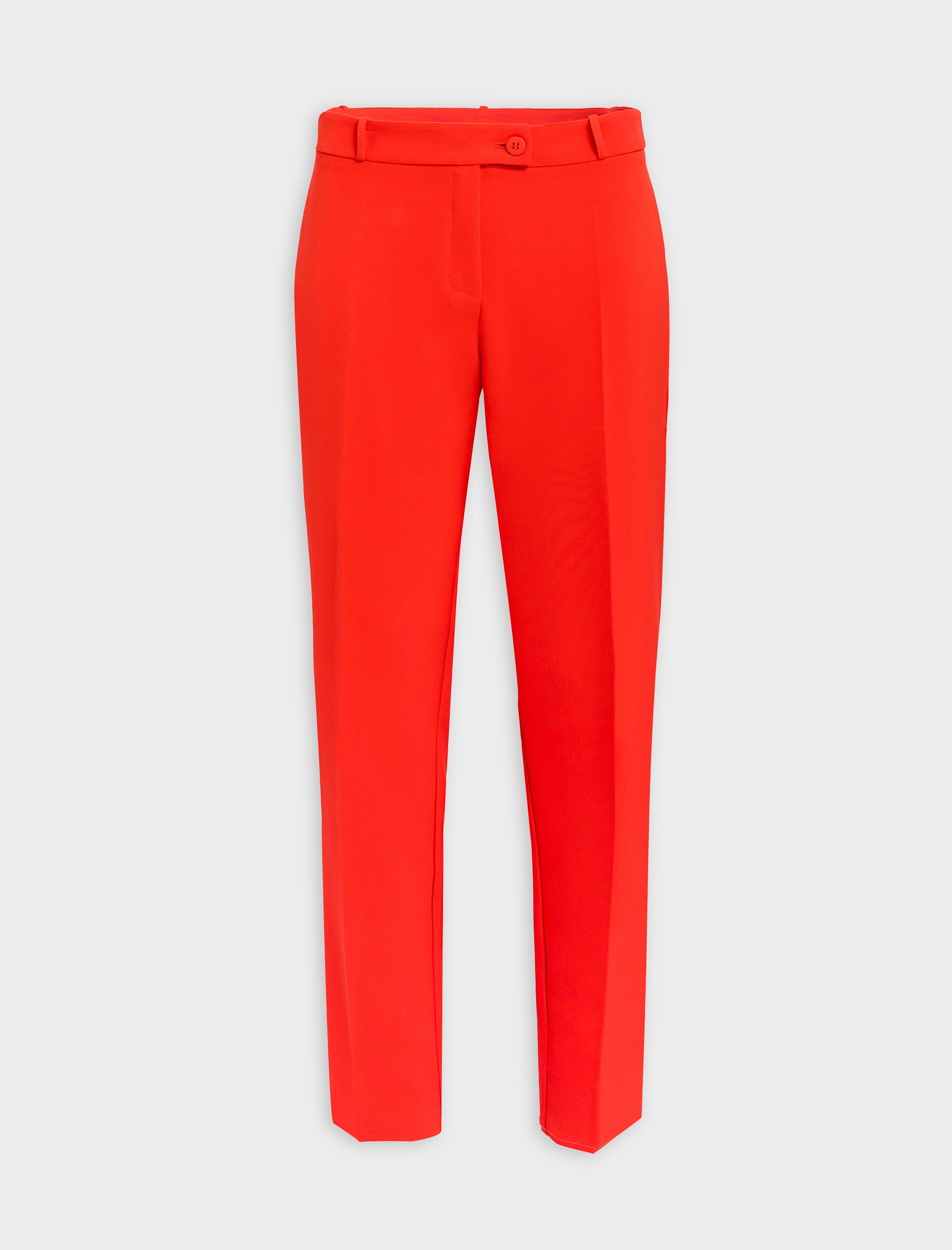 Total look con chaleco chic y pantalón para todo coral