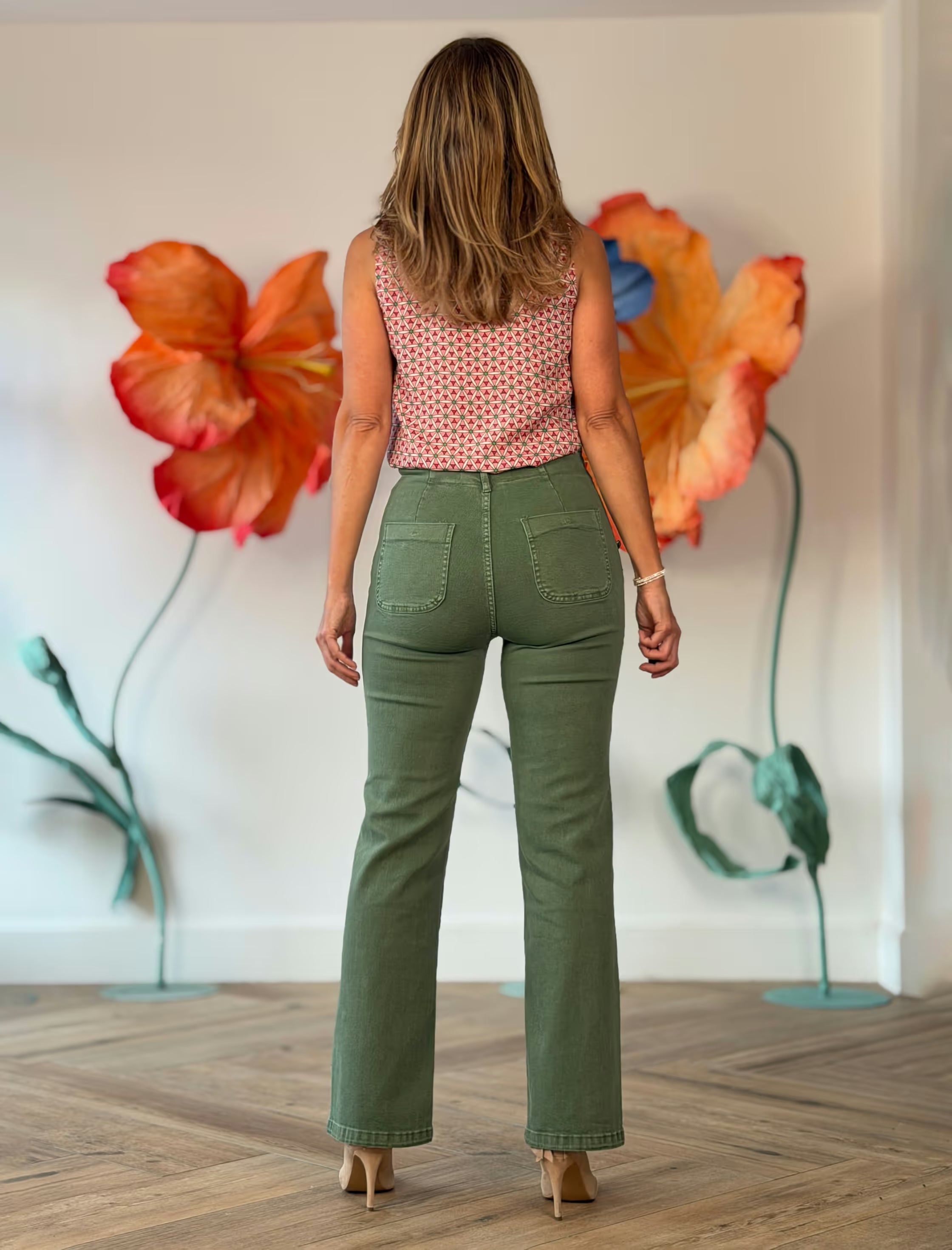 Green jeans with gold buttons