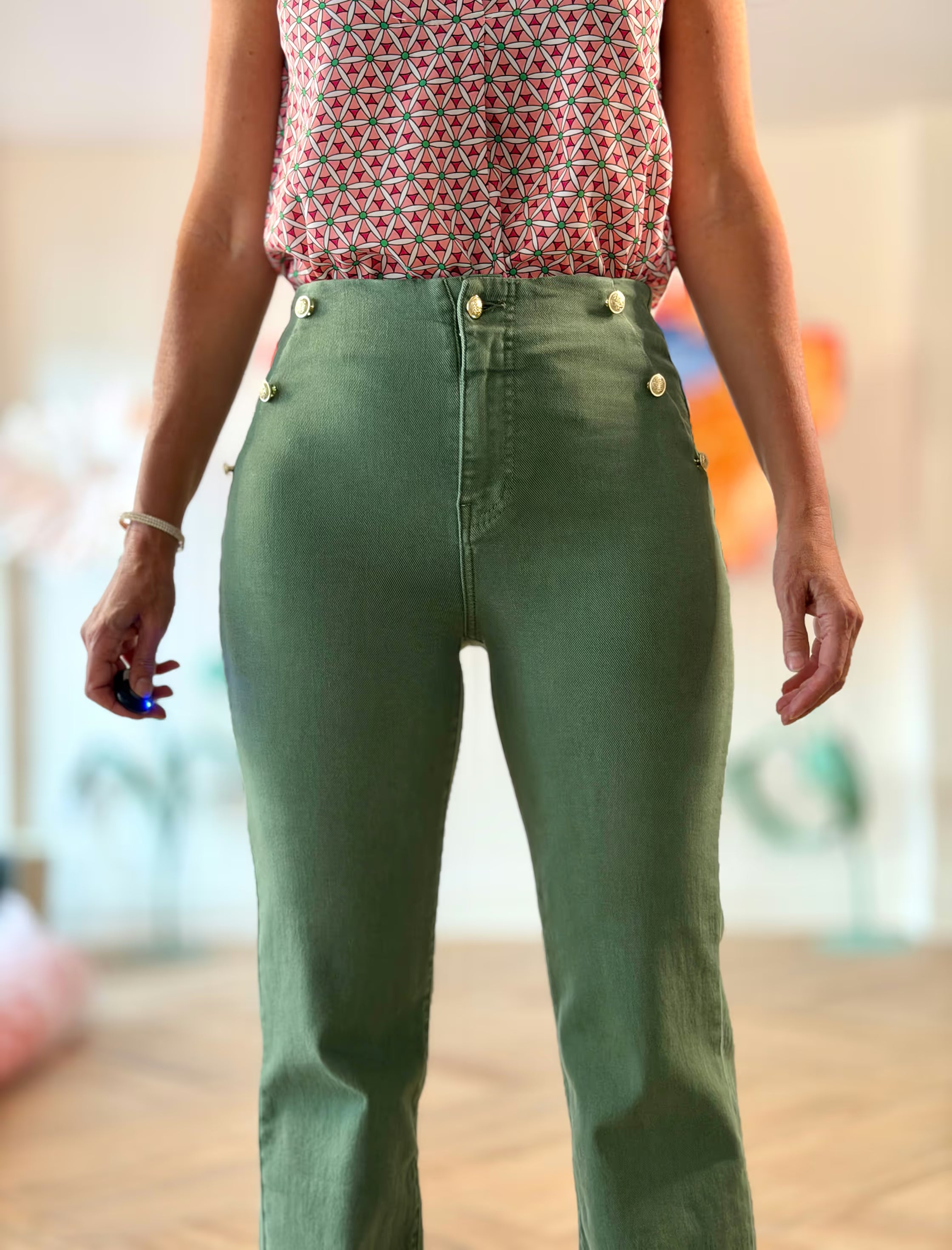 Green jeans with gold buttons