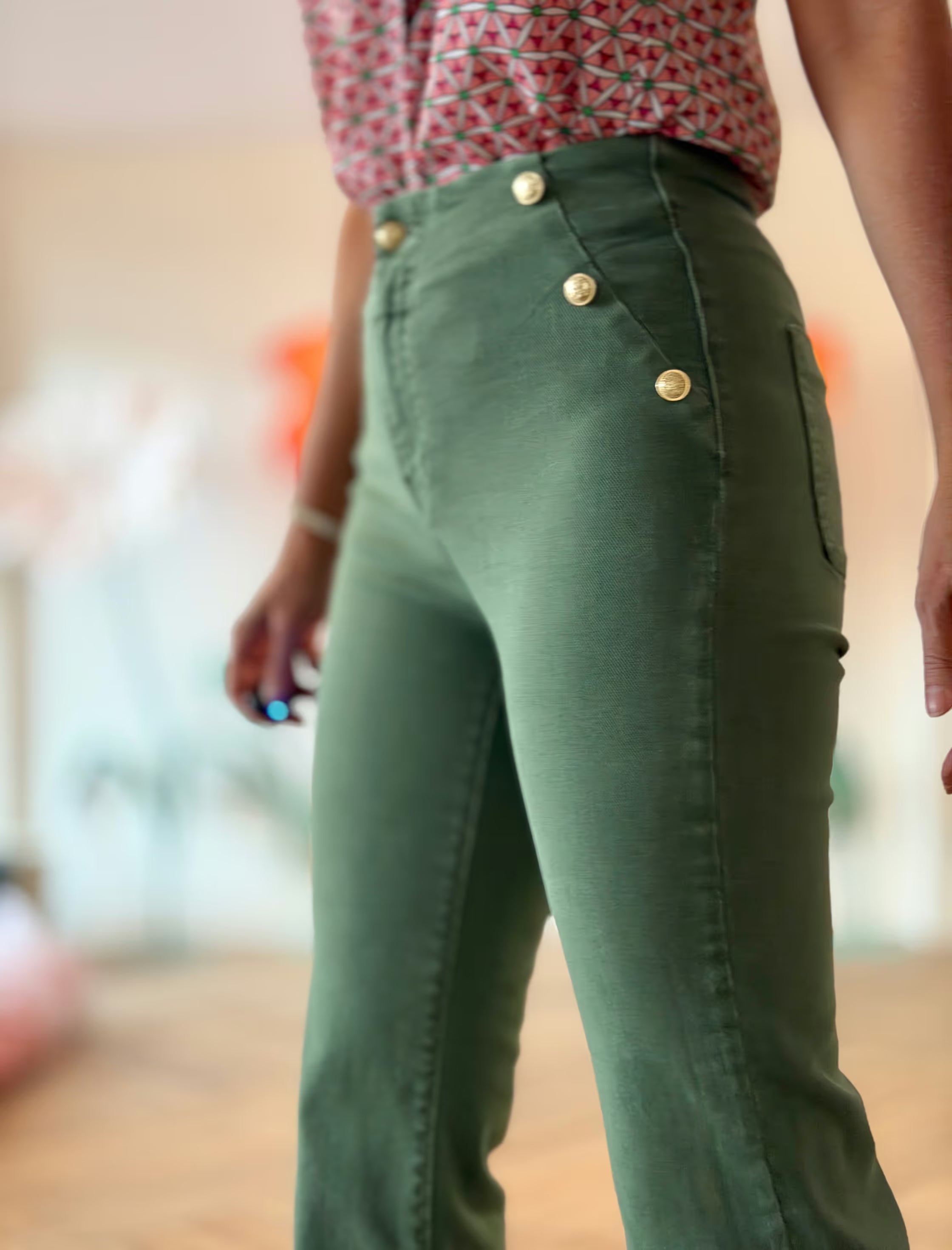 Green jeans with gold buttons
