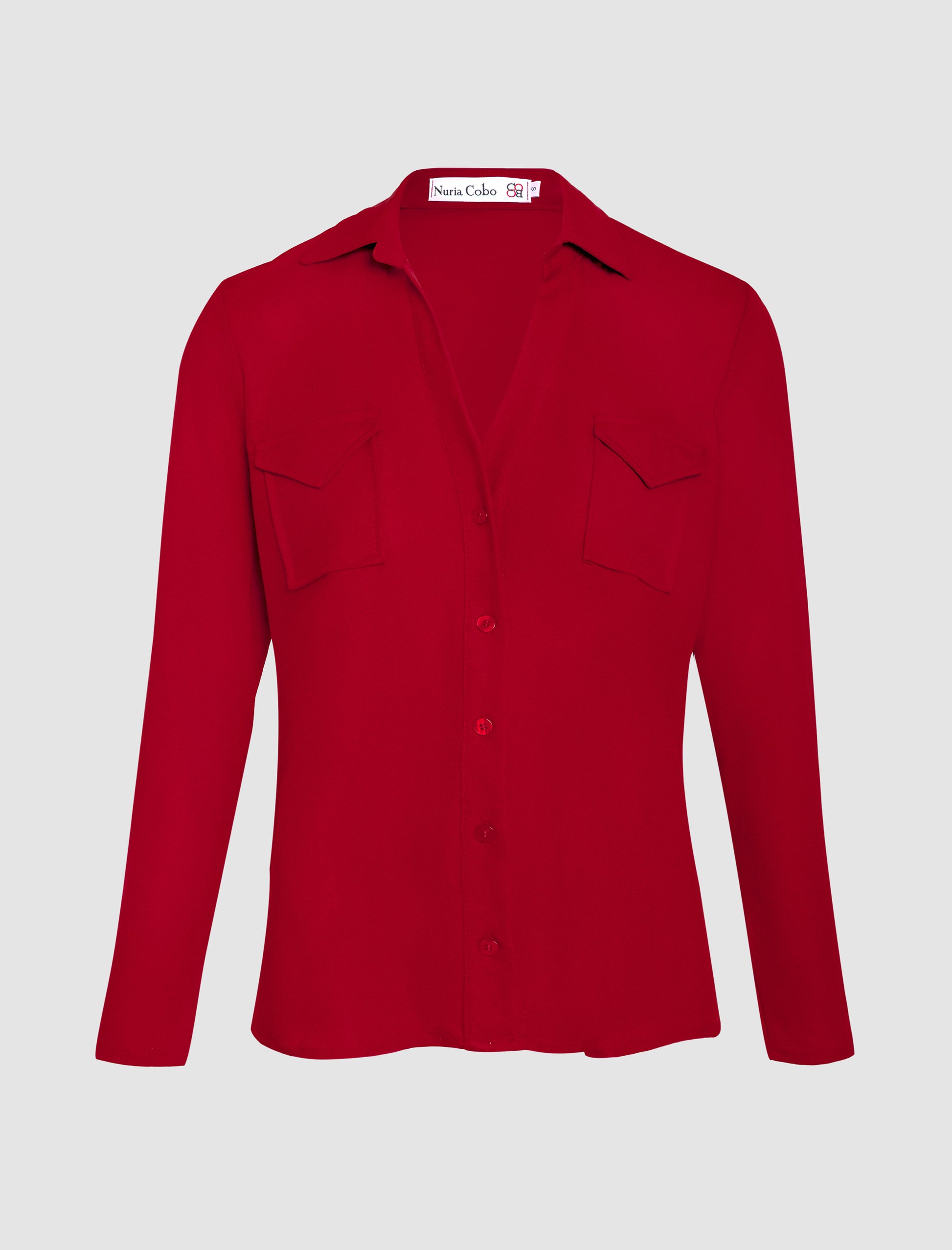 Camisa burdeos de manga larga para mujer con diseño elegante y corte favorecedor.